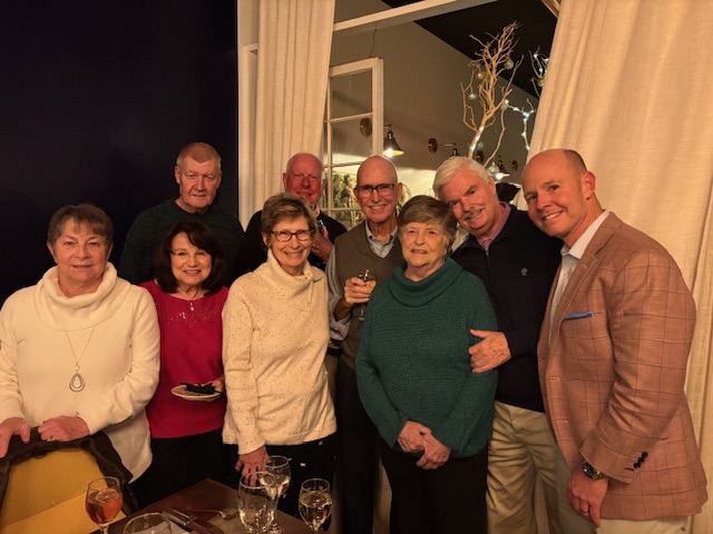 Compton Wealth Clients pose with big smiles at a Compton Wealth Client event.