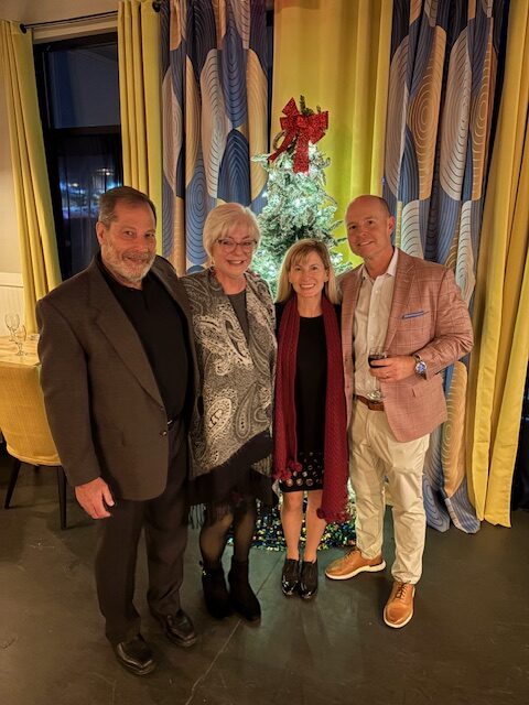Todd Compton and more happy Compton Wealth clients line up at the 2026 Christmas event.