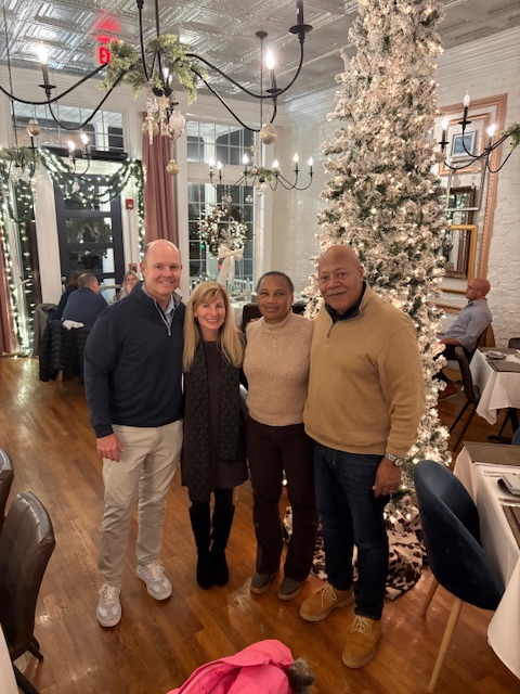 Clients post at a Compton Wealth Christmas event.