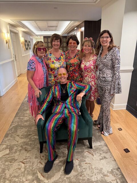 Todd Compton and clients rock full hippy style at a Compton Wealth Management Event