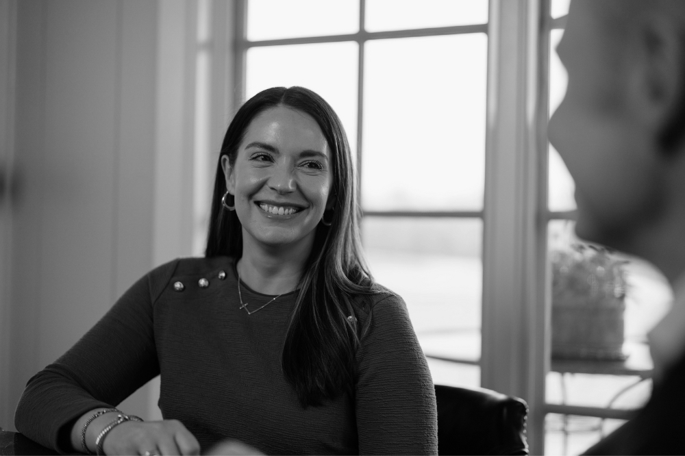 Catherine Taylor, Client Relationship Manager at Compton Wealth shares a joke with the team in their offices in Northern Virginia
