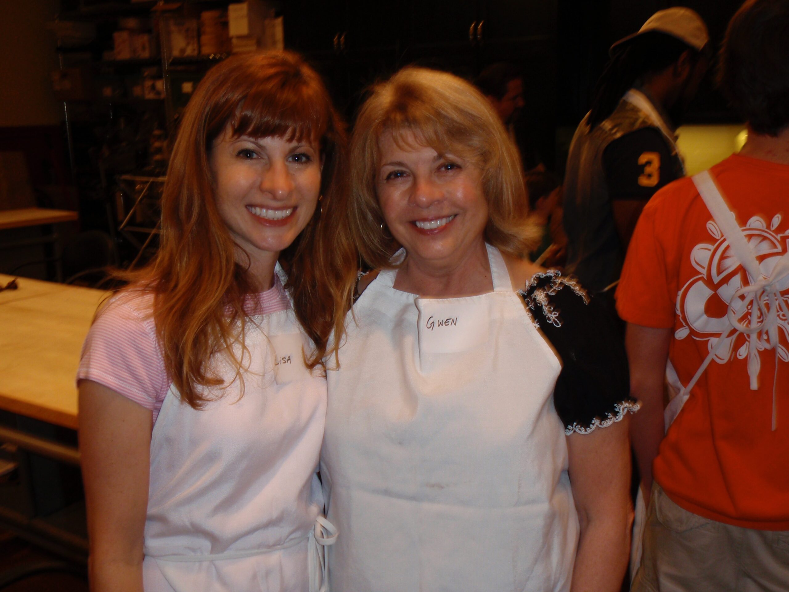 A happy client poses with Catherine Taylor of Compton Wealth at a client event.