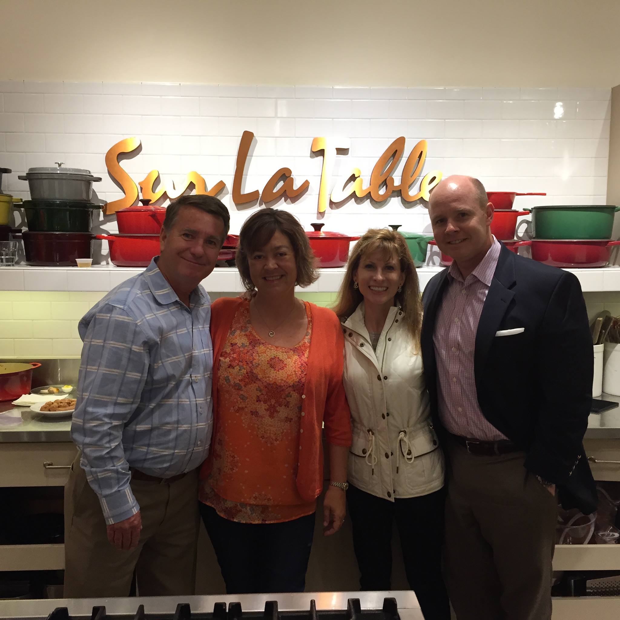 Todd Compton, Founder of Compton Wealth, poses with clients at a client event.